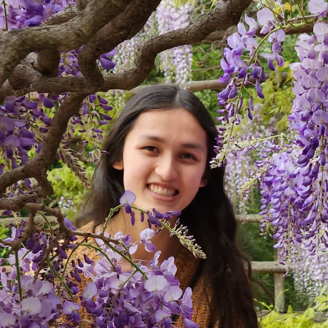 A picture of me with a foreground of wisteria